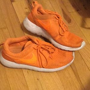 Orange Nike shoes